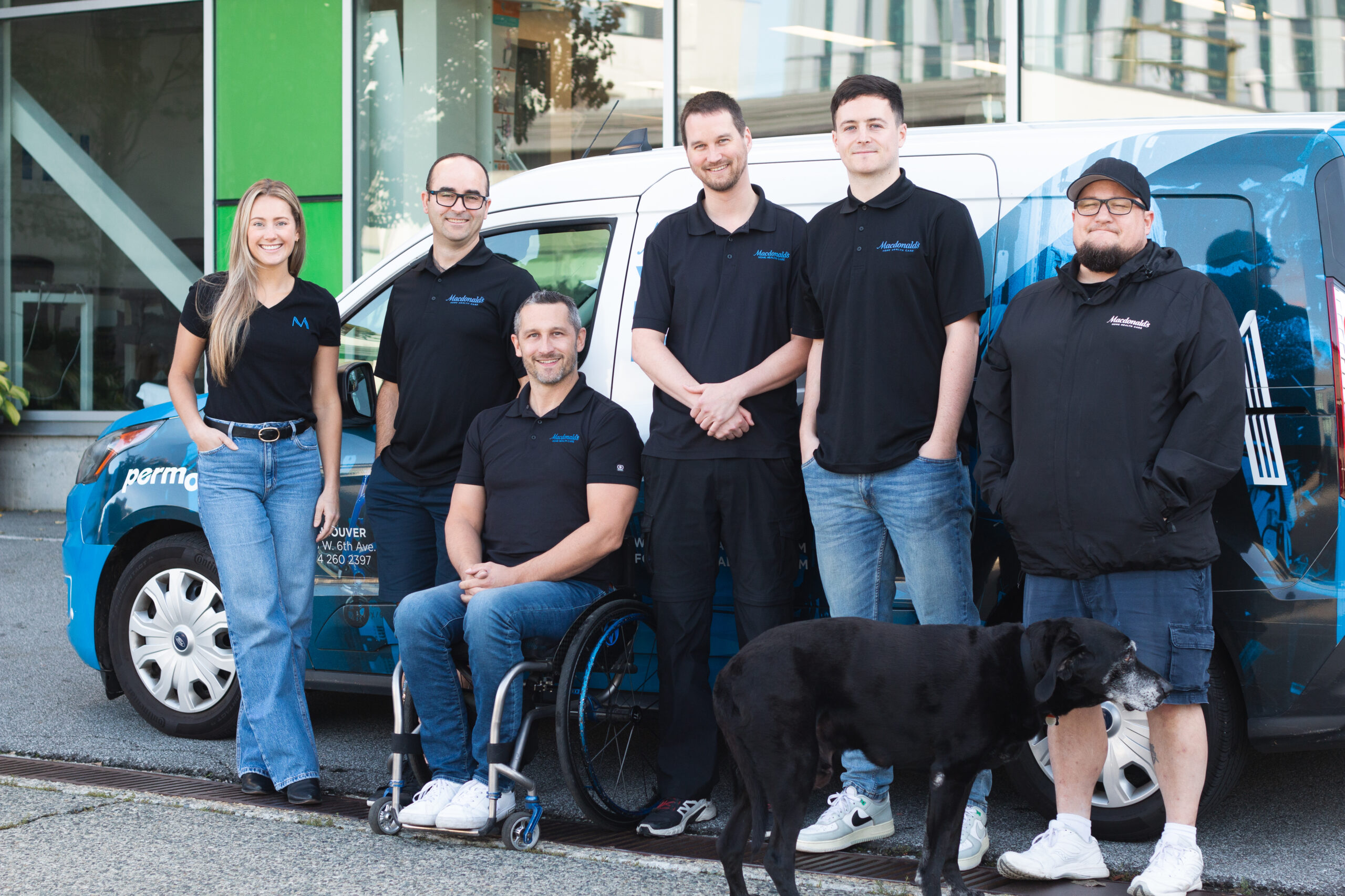 Image of the Complex Rehab team in front of a Macdonald's Home Health Care delivery van.