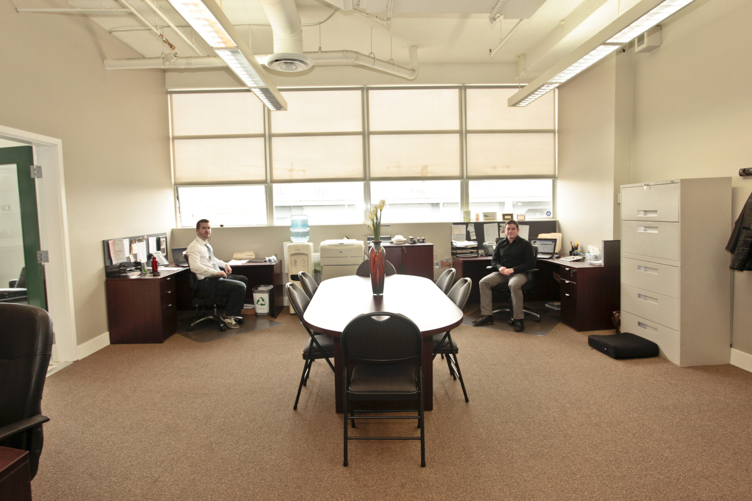 Evan Kellett and Pat Zuccaro sitting in their original office on west 6th ave