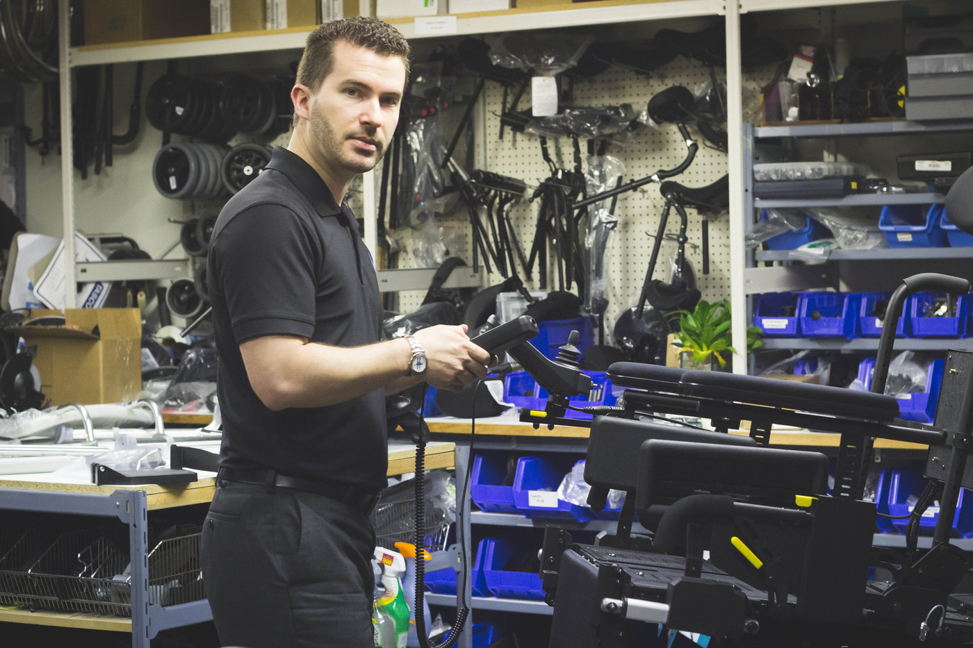 Evan Kellett making wheelchair adjustments in the new west 6th ave rehab location
